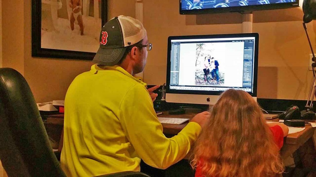 Dan's daughter helps him add some final tweaks to our family photo!